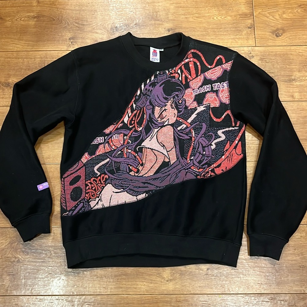 Apari x Trash Taste Anime Woven Crewneck
Length: 27-28”
Width: 22-23”